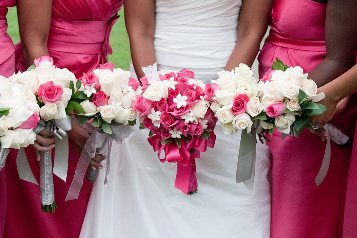 Bridal party in dresses with flowers